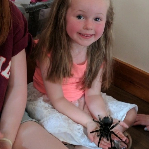 Girl holding a tarantula